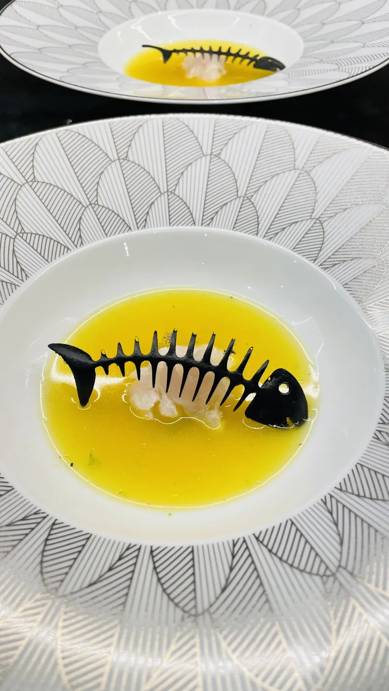 Grouper soup, grouper tartare, squid ink tuile